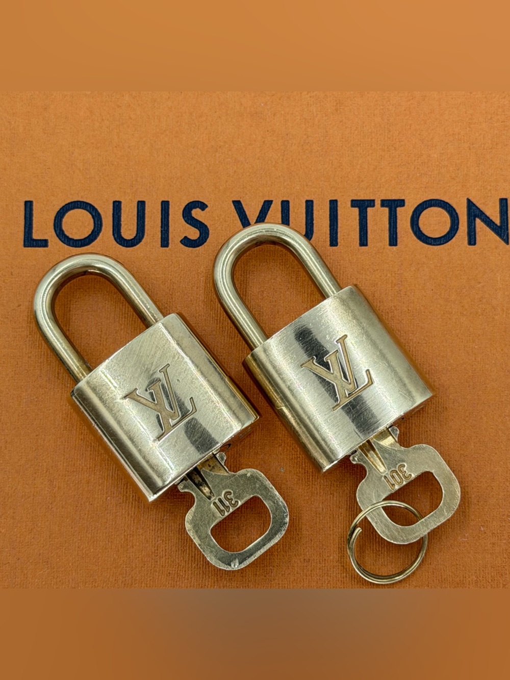 Bundle Two Louis Vuitton Authentic Gold-Tone Lock and Key Sets #301 and #311